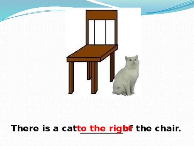 There is a cat __________of the chair. to the right 