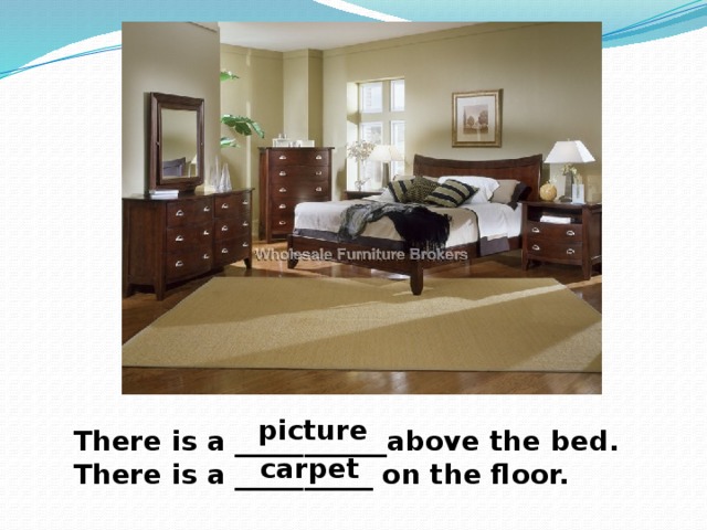 picture There is a ___________above the bed. There is a __________ on the floor.  carpet 