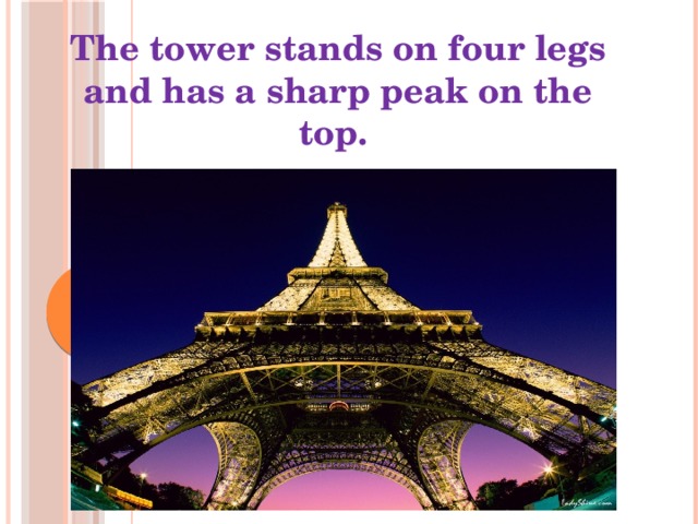 The tower stands on four legs and has a sharp peak on the top.