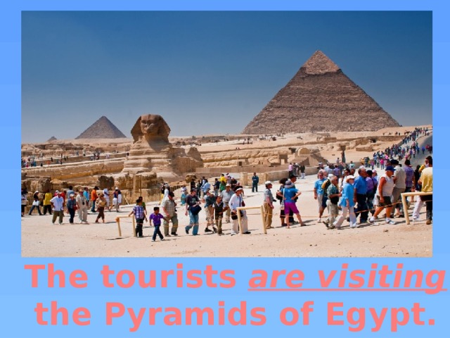 The tourists are visiting the Pyramids of Egypt.