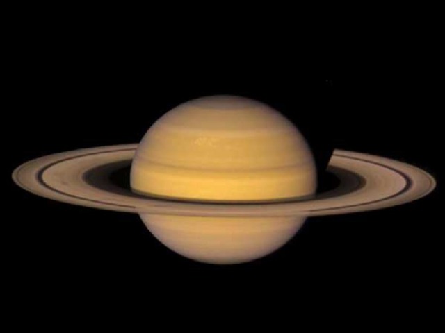 Saturn *Saturn is the sixth planet from the sun *It is 9.54 AU from the sun *It orbits the sun in 29.5 years *It takes 11 hours for Saturn to spin on its axis *It weighs 95 times that of the Earth *It is 9.42 times wider than the Earth *It has a gaseous surface. * Saturn's interior is hot (12000 K at the core) *It is named after Zeus' father, the god of agriculture *Saturn has 18 named moons *It has the best developed ring system in the Solar sytem *The rings were discovered by Gallileo using an early telescope *The rings are very thin - ony 1.5km wide 