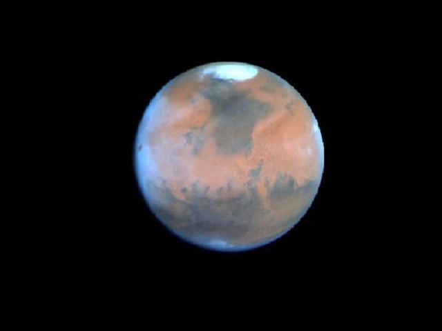 Mars *Mars is the last planet of the inner solar system *It is the fourth planet from the sun *It is usually 1.524 Au from the sun *It takes 1.9 earth years to orbit the sun *It takes 24.5 hours to spin on its axis *It masses about 11% of the Earth *It is 53% as wide as the Earth *The surface temperature ranges between -140oC and 20oC *It has two moons - Phobos and Deimos *It is named after the god of war *It has a thin atmosphere of carbon dioxide (95%),nitrogen, argon and water *Its low density probably relates to a core of iron and iron sulfide *It may have had running water at some time in the past *It may have liquid water on the surface now (this is a point of much investigation) *The polar caps are made of solid carbon dioxide 