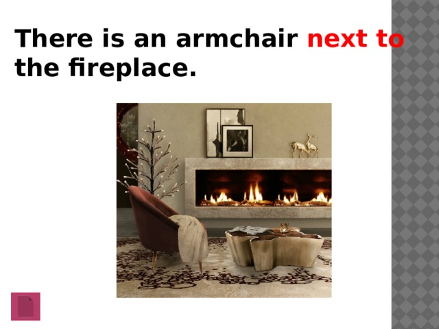 There is an armchair next to the fireplace.   