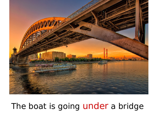 The boat is going under a bridge 