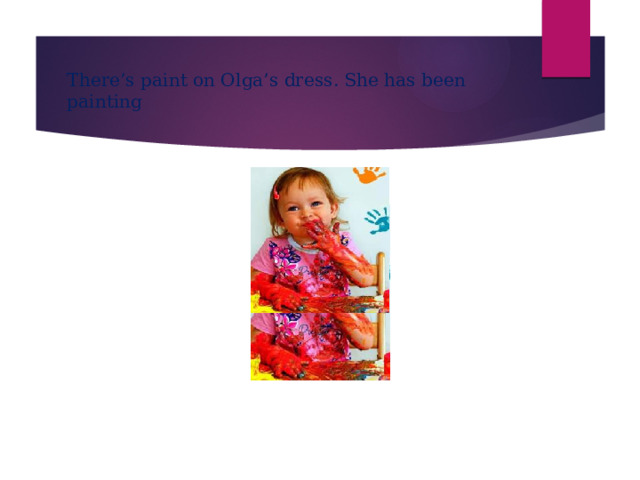 There’s paint on Olga’s dress. She has been painting 