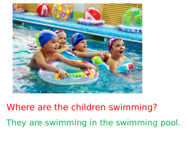 Where are the children swimming? They are swimming in the swimming pool. 